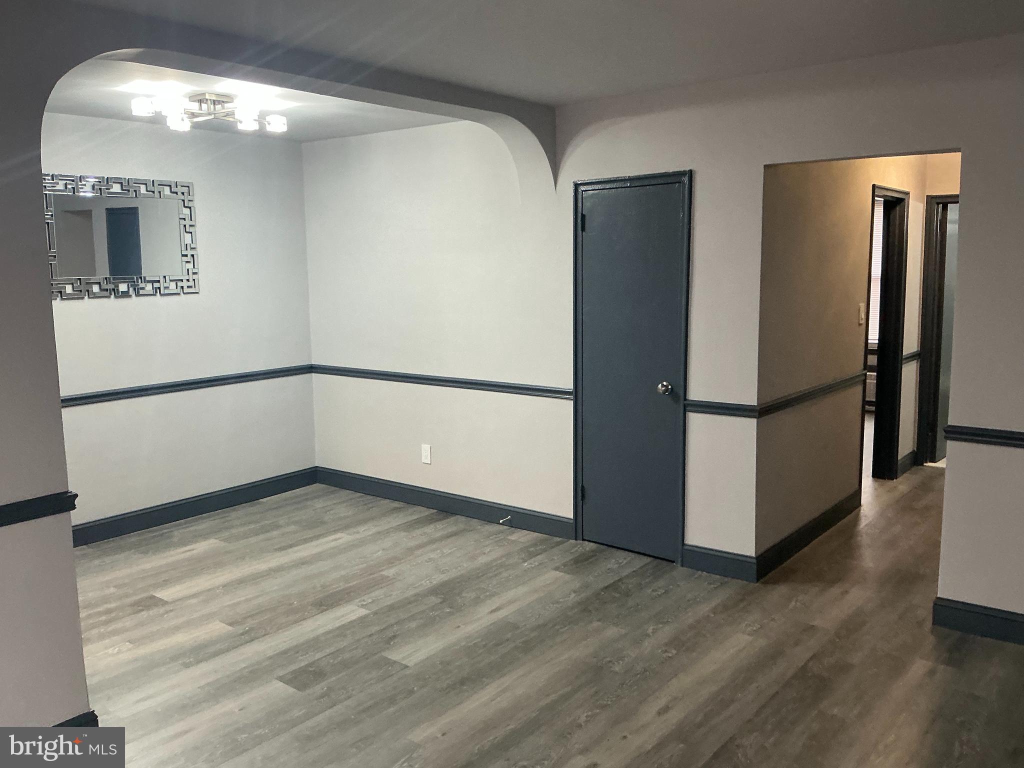 4004 E Street Southeast, Unit 106 Washington, DC 20019 - Photo 10 of 17 a view of a refrigerator in kitchen and wooden floor