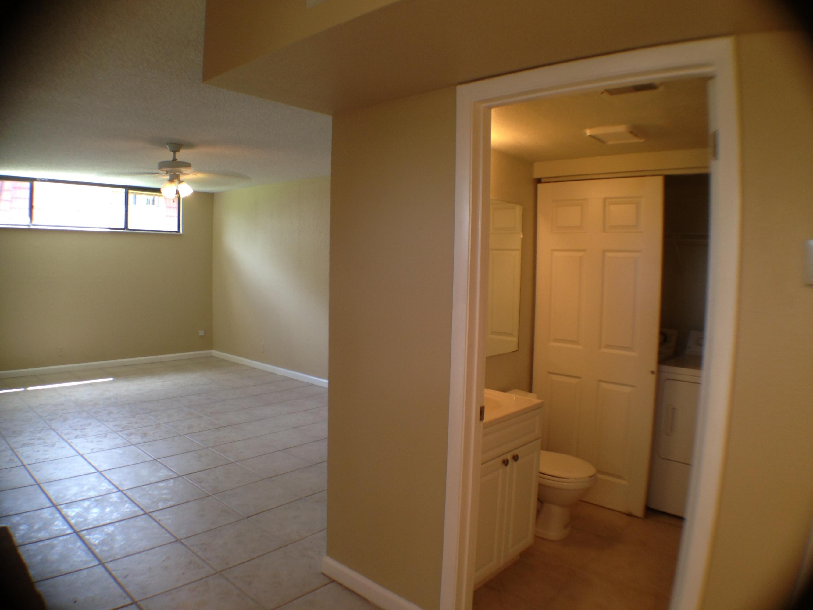 8237 Severn Drive, Unit B Boca Raton, FL 33433 - Photo 8 of 17 Half Bath, Laundry and Living Room
