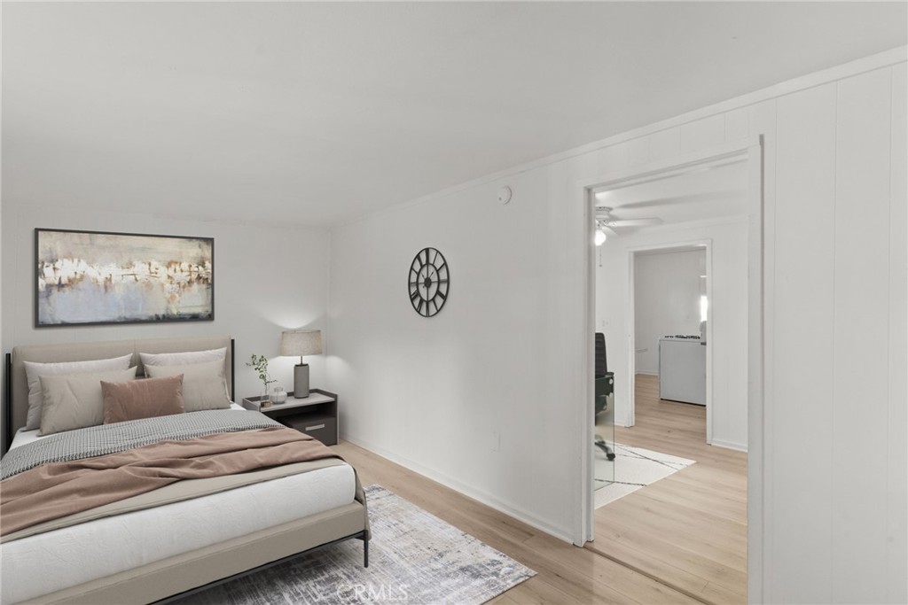 7053 Sunnycrest Trail Tujunga, CA 91042 - Photo 13 of 19 a bedroom with a bed and a painting on the wall