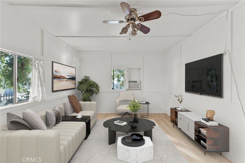 7053 Sunnycrest Trail Tujunga, CA 91042 - Photo 3 of 19 a living room with furniture and a flat screen tv