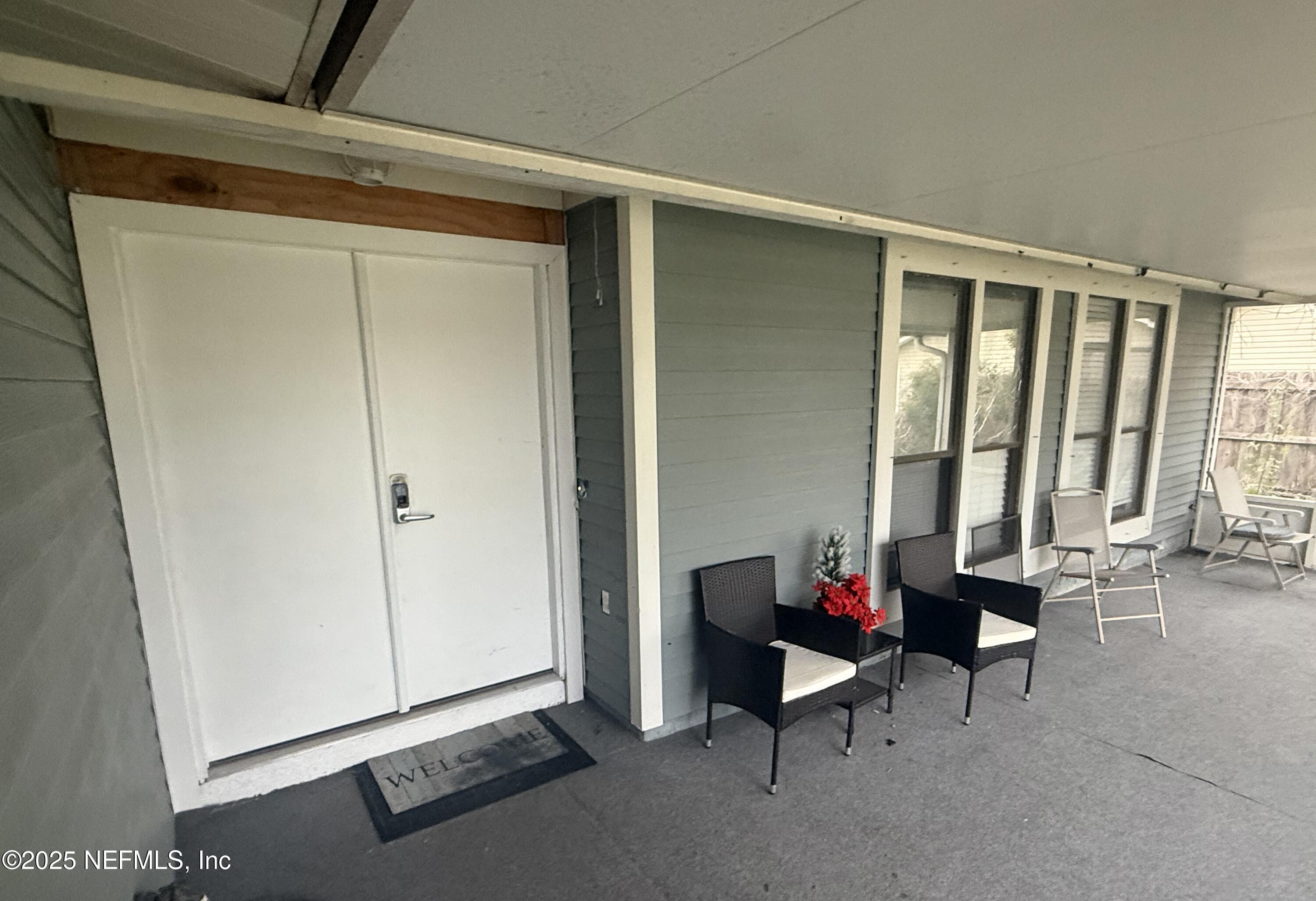 4026 Cedar Island Road East Jacksonville, FL 32250 - Photo 2 of 26 a living room with furniture and a window