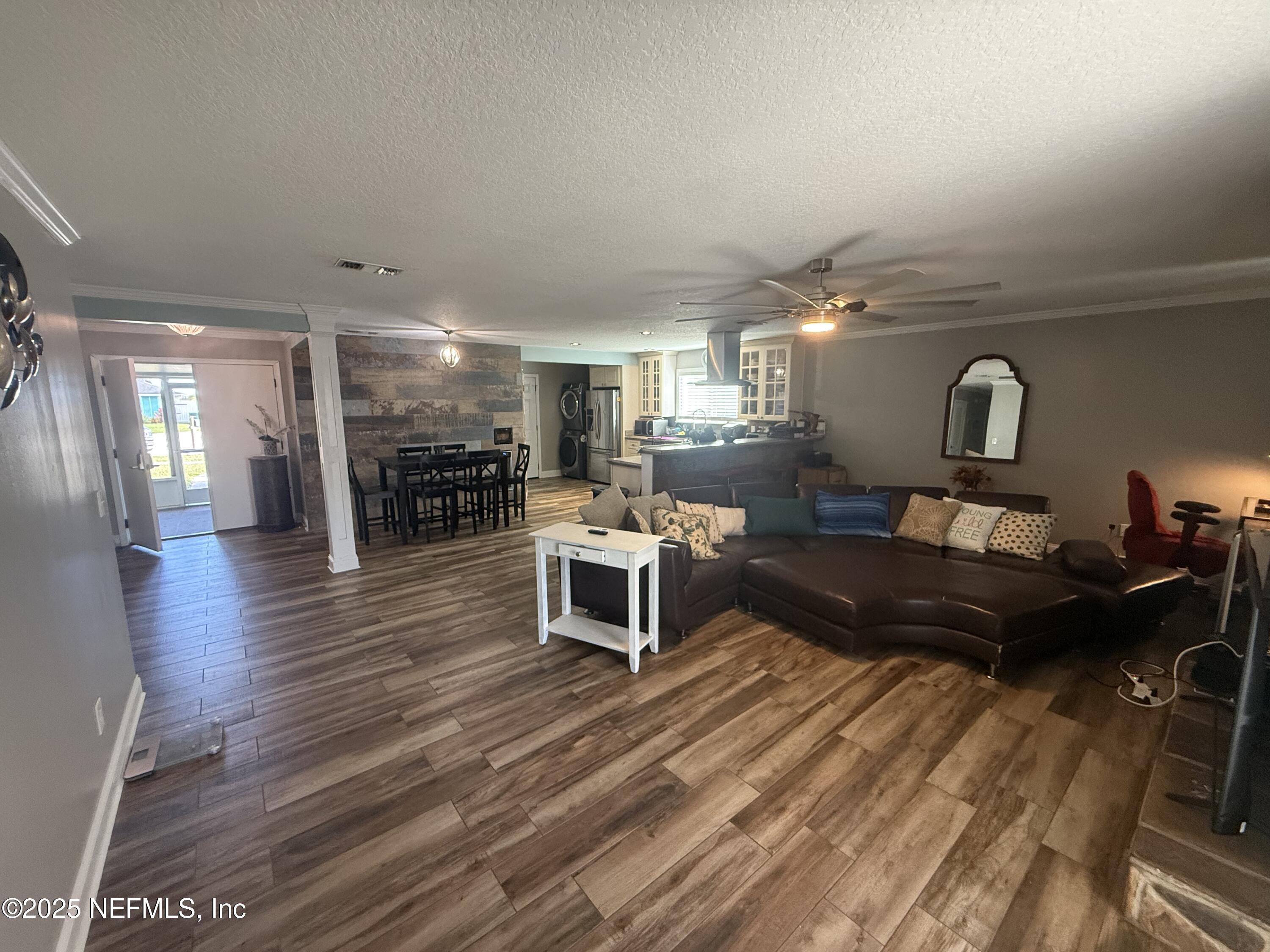 4026 Cedar Island Road East Jacksonville, FL 32250 - Photo 4 of 26 a living room with furniture and wooden floor