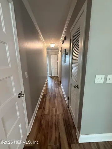 a bedroom with a bed and a mirror