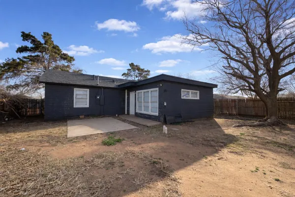 a house with a tree in the background