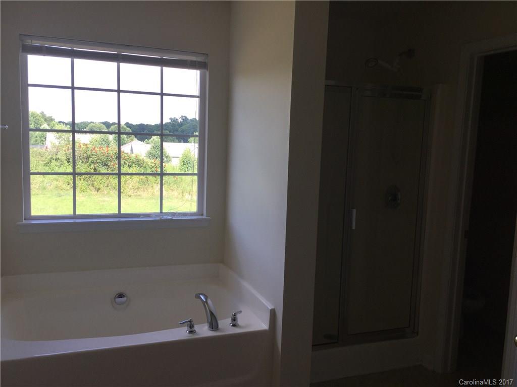 6304 Trotters Ridge Road Charlotte, NC 28227 - Photo 8 of 9 a bathroom with a bathtub