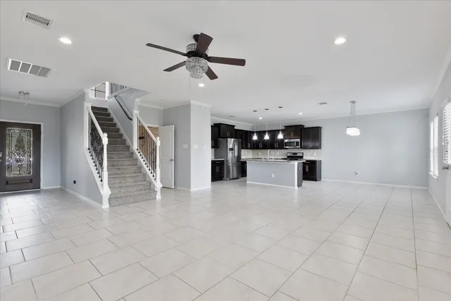 a view of kitchen with furniture and white cabinets