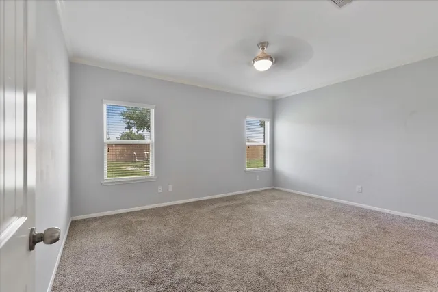 a view of an empty room with a window