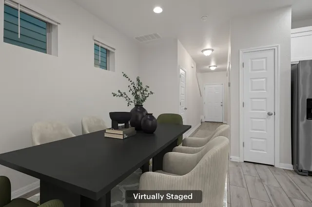 a living room with furniture and a table