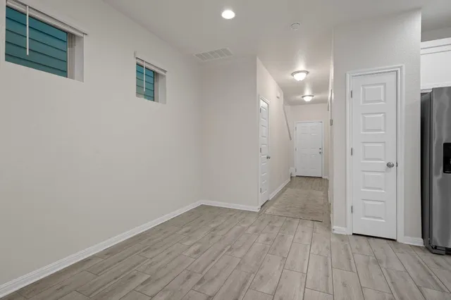 a view of a livingroom with furniture and wooden floor