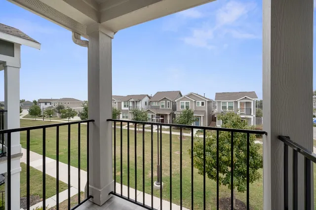 an empty room with fan and windows