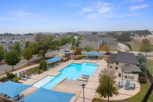 a view of a city with lawn chairs