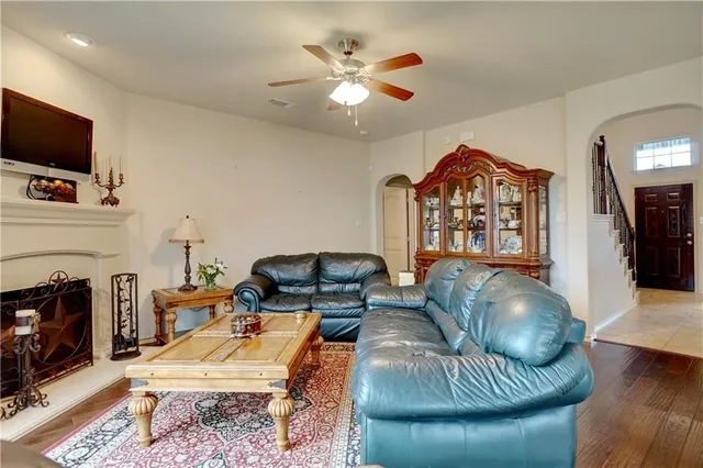 a living room with furniture and a flat screen tv