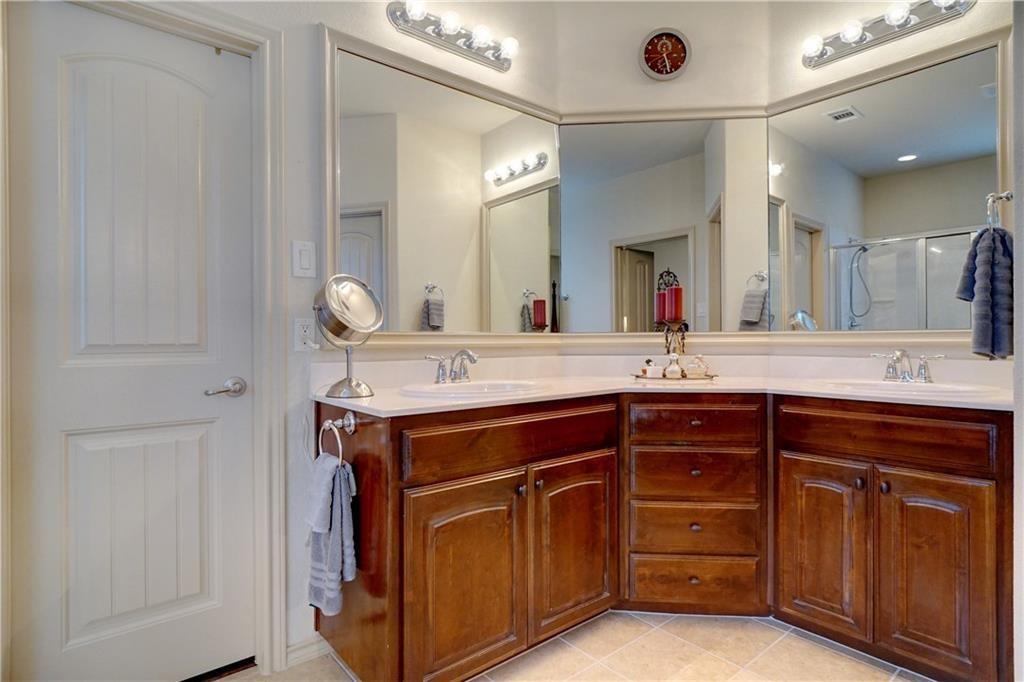 13212 Larks View Point Fort Worth, TX 76244 - Photo 24 of 36 a bathroom with a granite countertop sink and a mirror