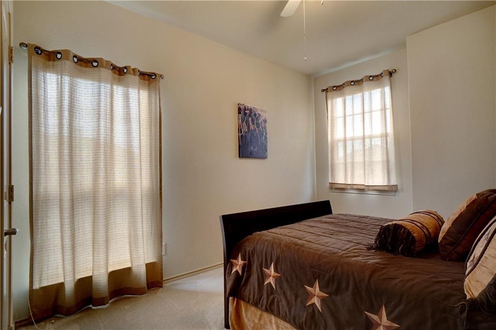 13212 Larks View Point Fort Worth, TX 76244 - Photo 28 of 36 a bedroom with a bed and a window