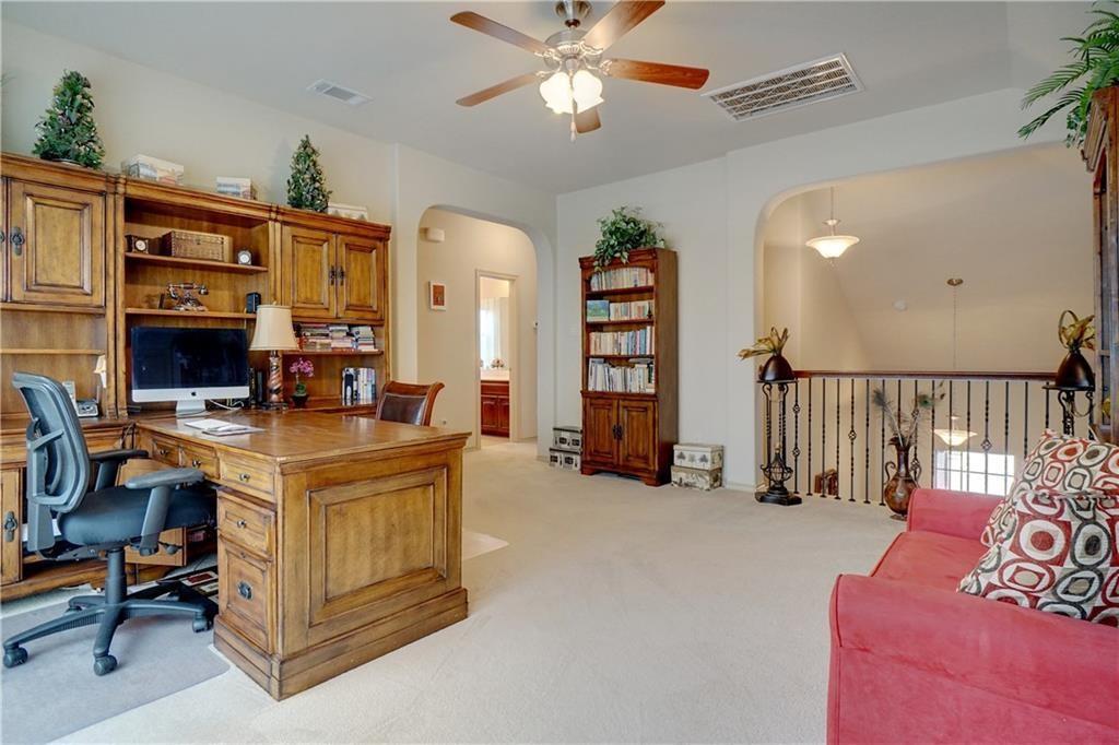 13212 Larks View Point Fort Worth, TX 76244 - Photo 32 of 36 a living room with furniture and a chandelier