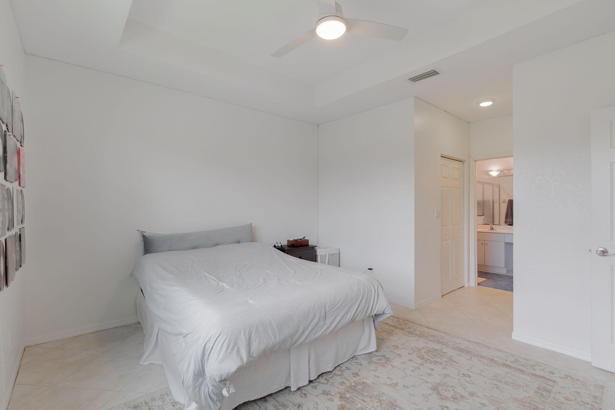 115 Coconut Key Lane Delray Beach, FL 33484 - Photo 12 of 23 a bedroom with a bed and a view of bathroom