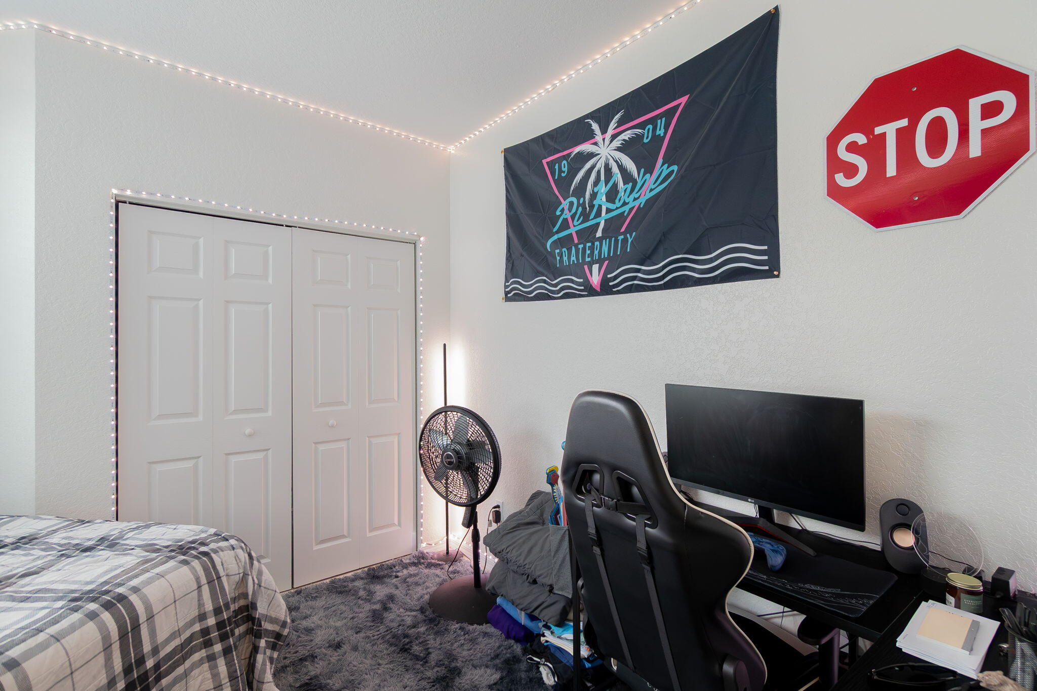 115 Coconut Key Lane Delray Beach, FL 33484 - Photo 15 of 23 a bedroom with a bed and a chair