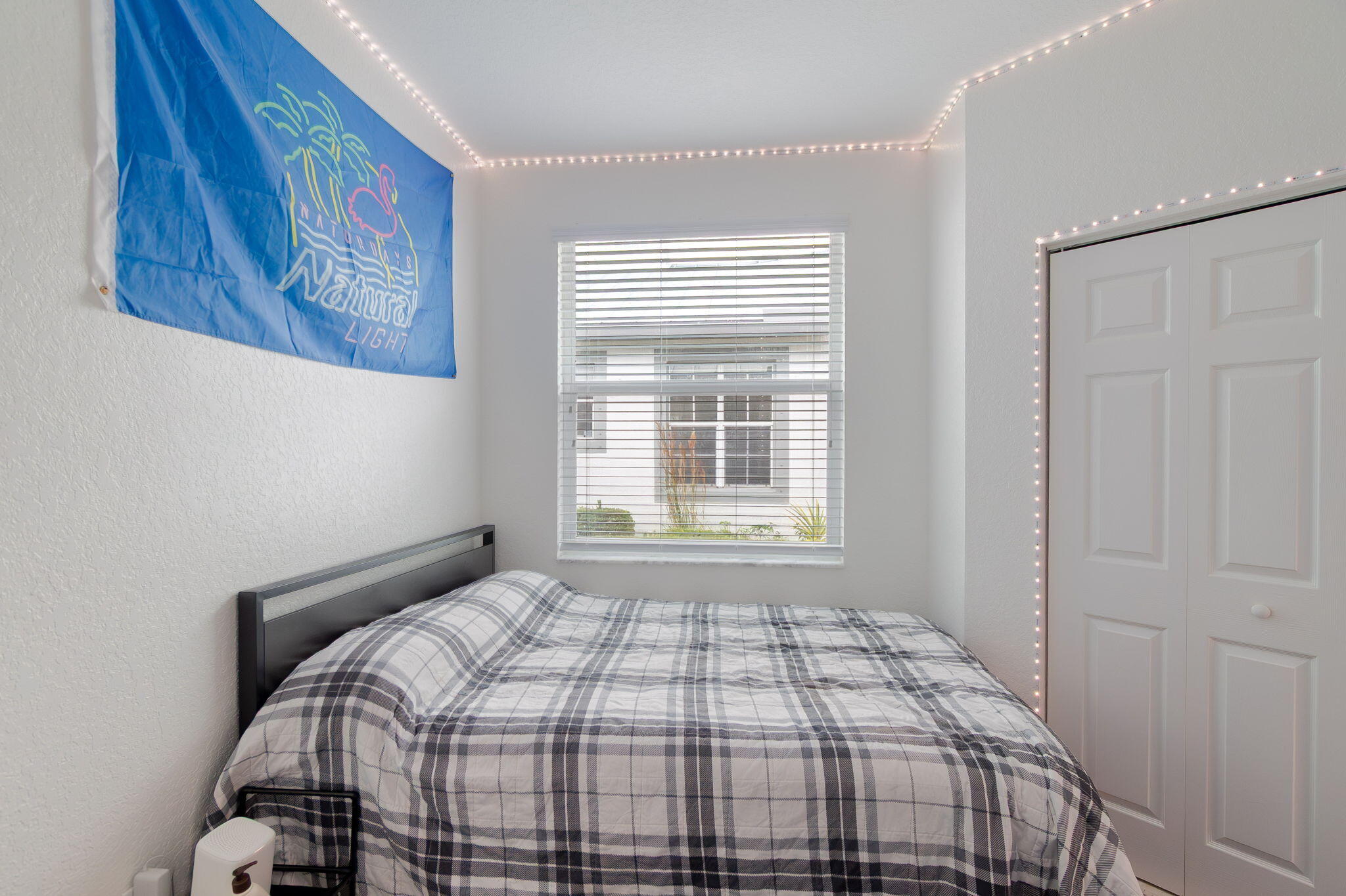 115 Coconut Key Lane Delray Beach, FL 33484 - Photo 16 of 23 a bedroom with a bed and a window