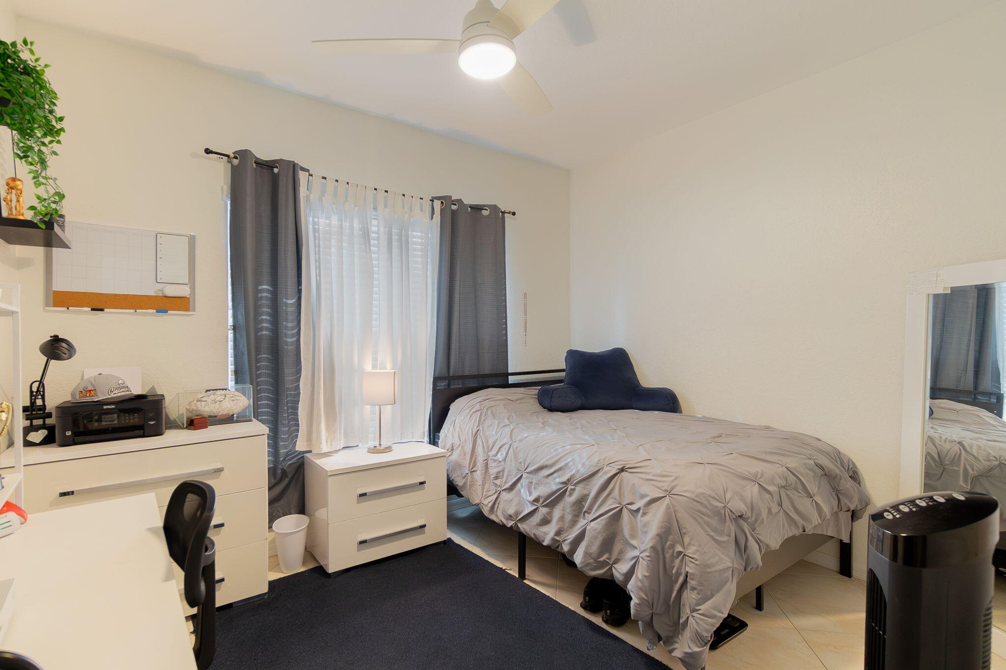 115 Coconut Key Lane Delray Beach, FL 33484 - Photo 18 of 23 a bedroom with a bed and a flat screen tv