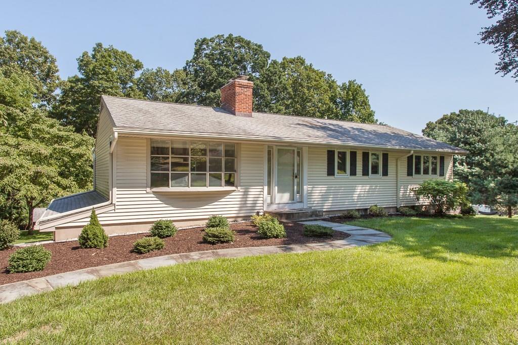 843 Indian Hill Road Orange, CT 06477 - Photo 1 of 1 a front view of house with yard and green space