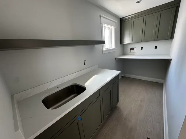 a kitchen with a cabinets and white appliances