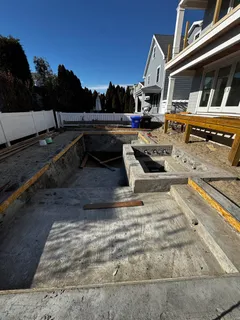 a view of a house with pool and a yard