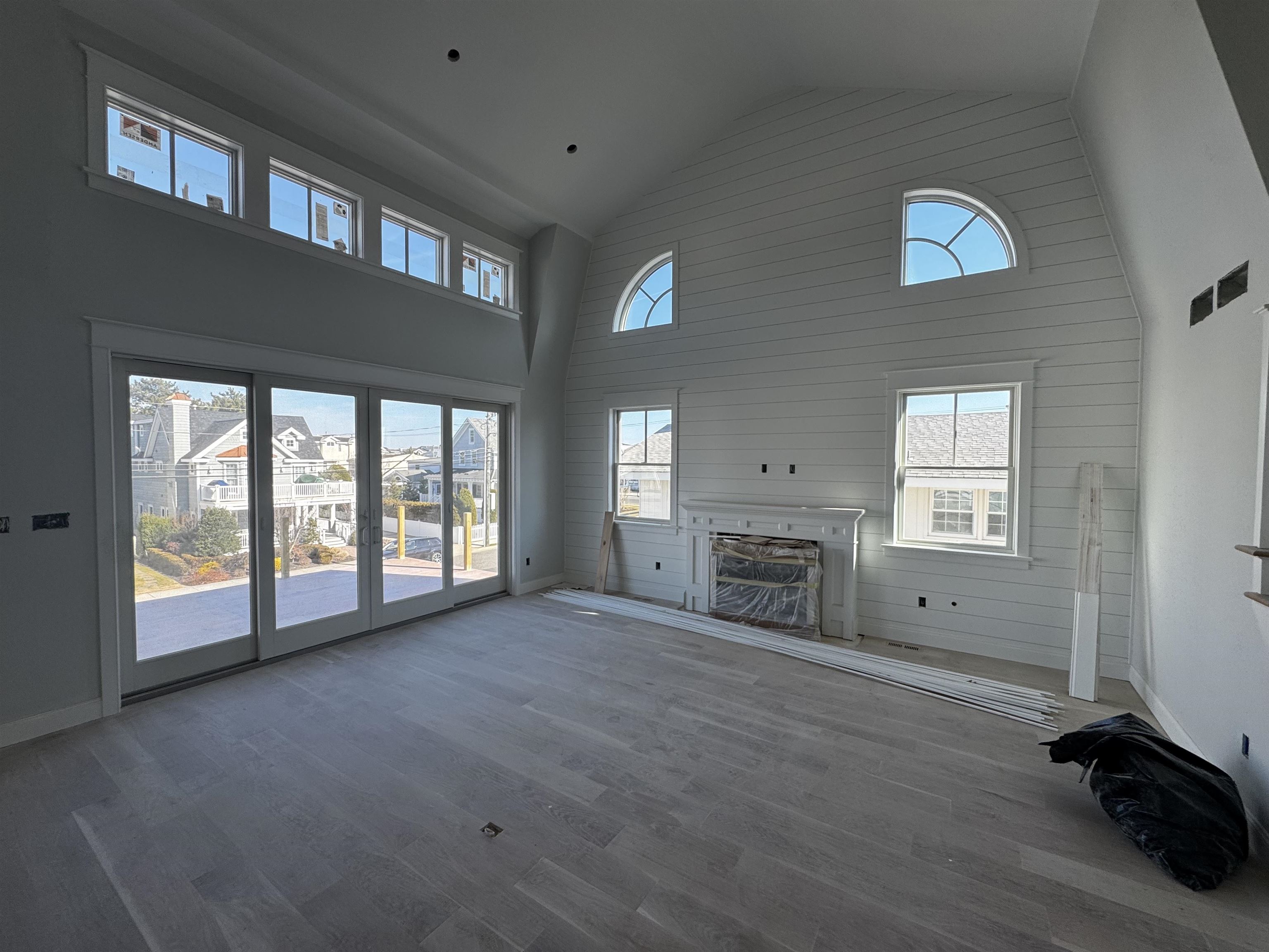 34 West 13th Street Avalon, NJ 08202 - Photo 4 of 28 a view of an empty room with a fireplace and a window