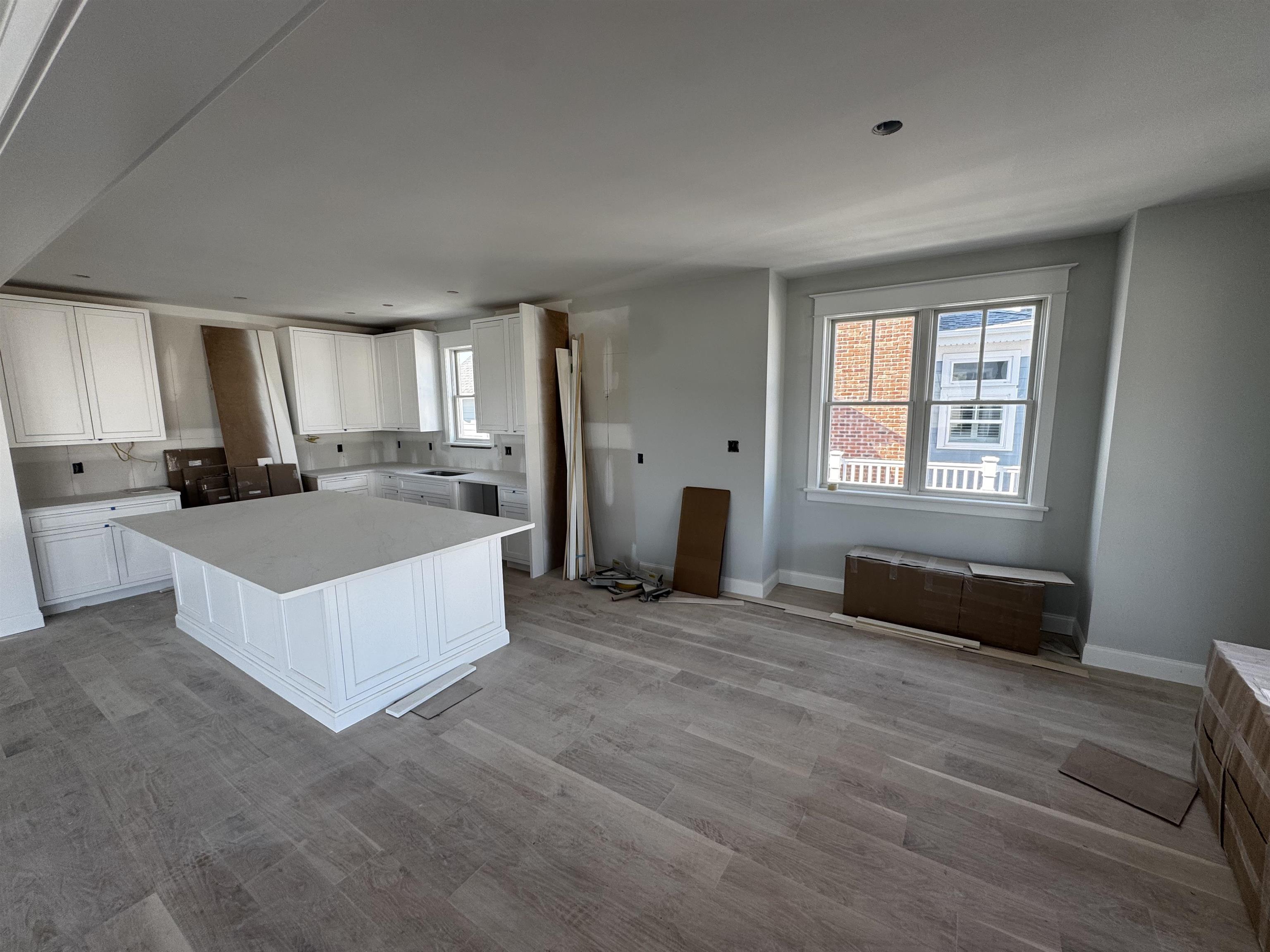 34 West 13th Street Avalon, NJ 08202 - Photo 6 of 28 a large white open kitchen with a large window