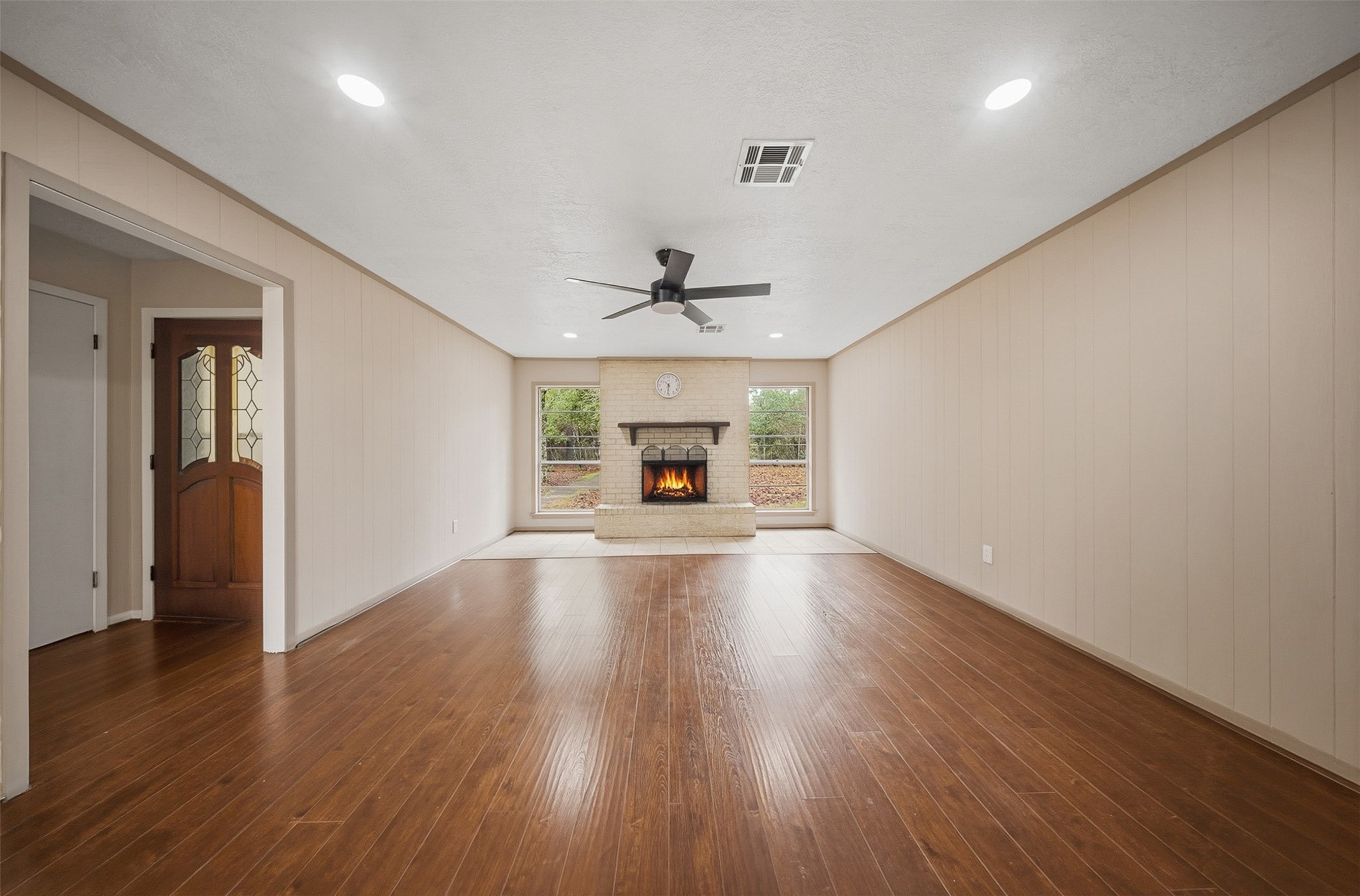 401 Turner Cemetery Road Livingston, TX 77351 - Photo 2 of 34 an empty room with wooden floor chandelier and windows