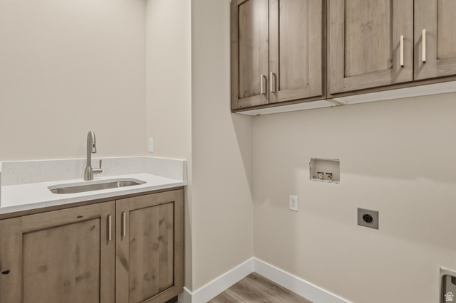 169 West 100 South Joseph, UT 84739 - Photo 27 of 35 Laundry room featuring cabinet space, washer hookup, electric dryer hookup, and light wood finished floors