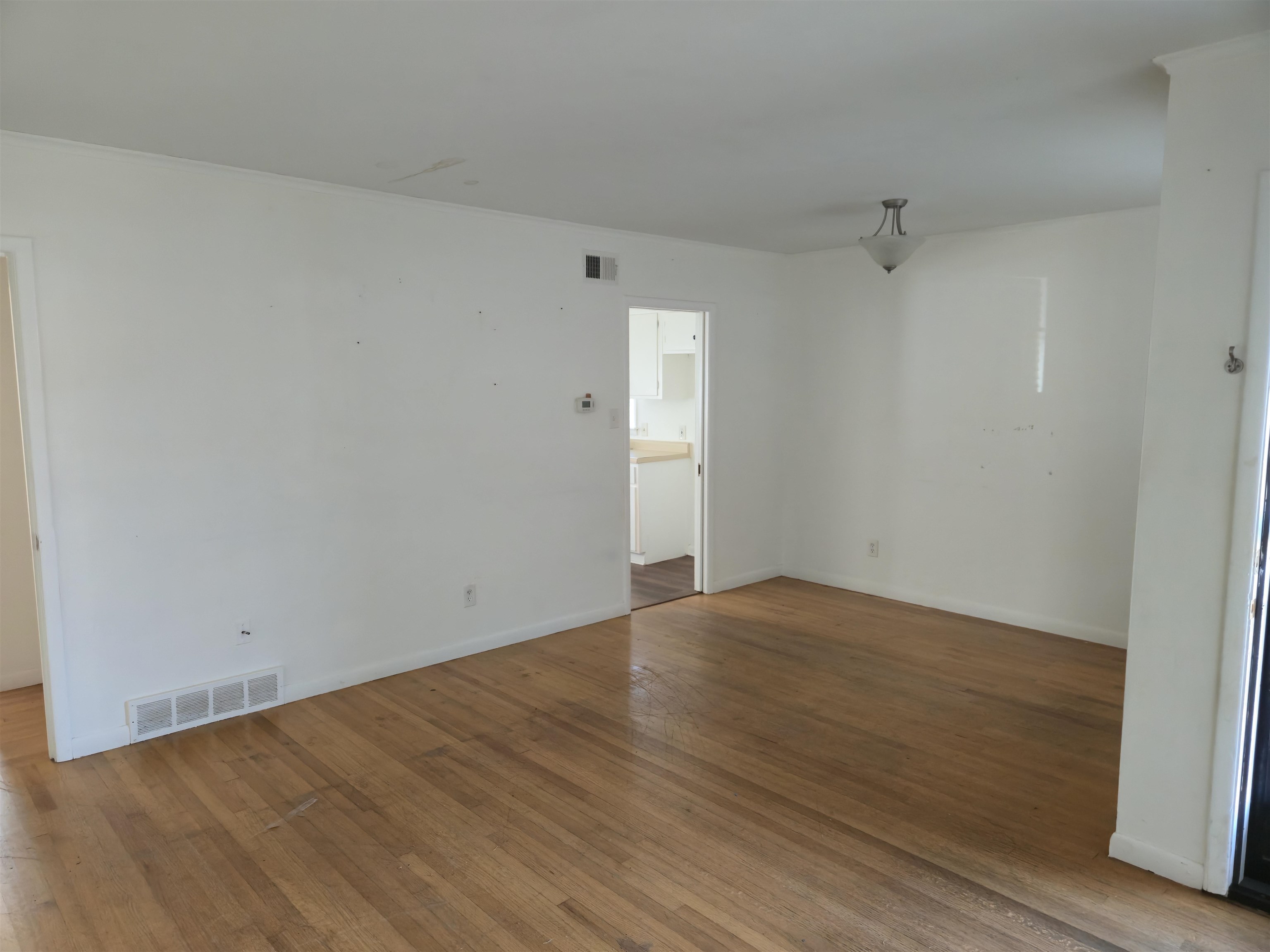 1517 Delmont Road Memphis, TN 38117 - Photo 2 of 9 Spare room featuring hardwood / wood-style floors