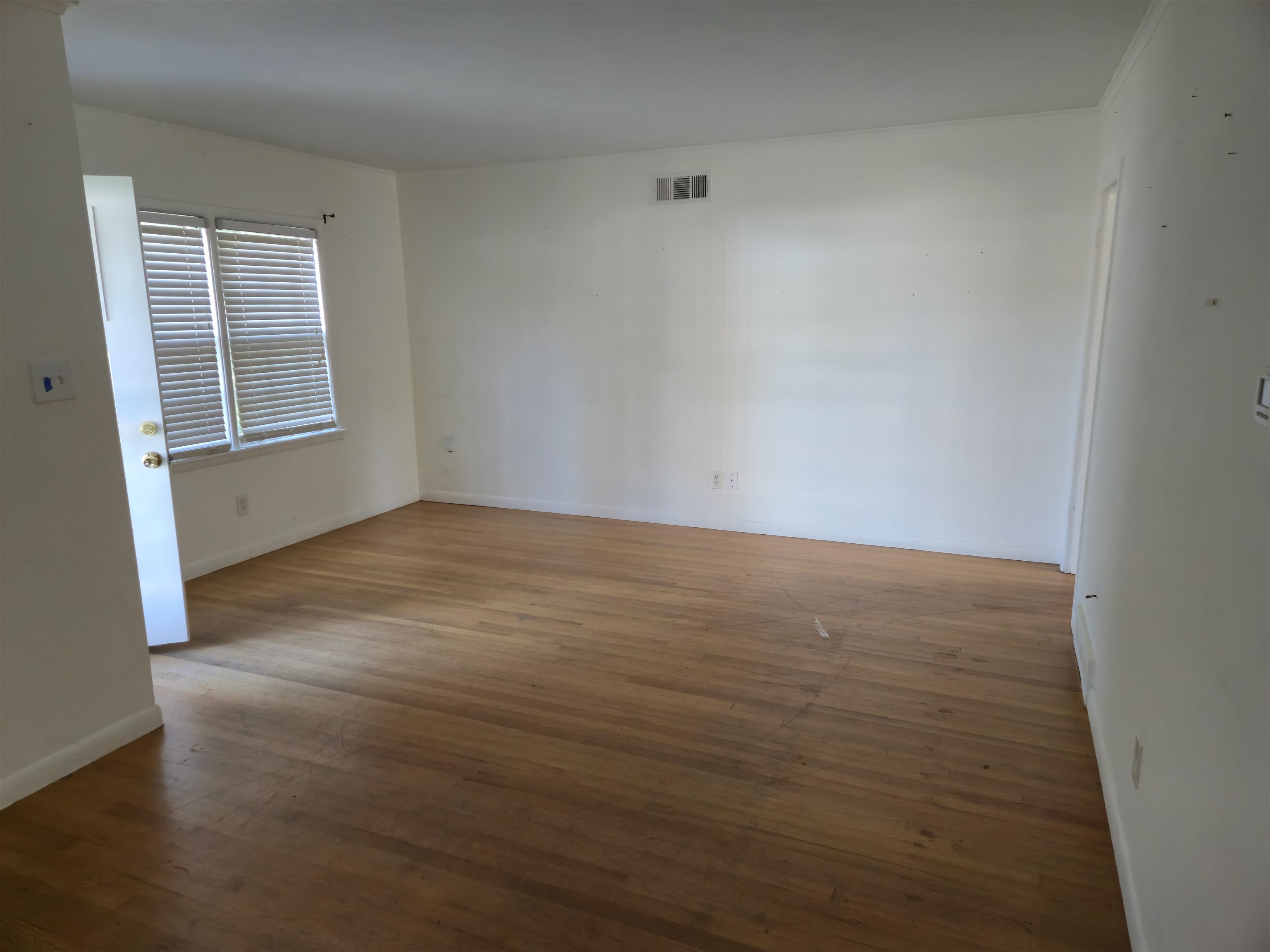 1517 Delmont Road Memphis, TN 38117 - Photo 3 of 9 Unfurnished room featuring wood finished floors
