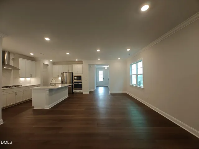 a view of a kitchen and dining room