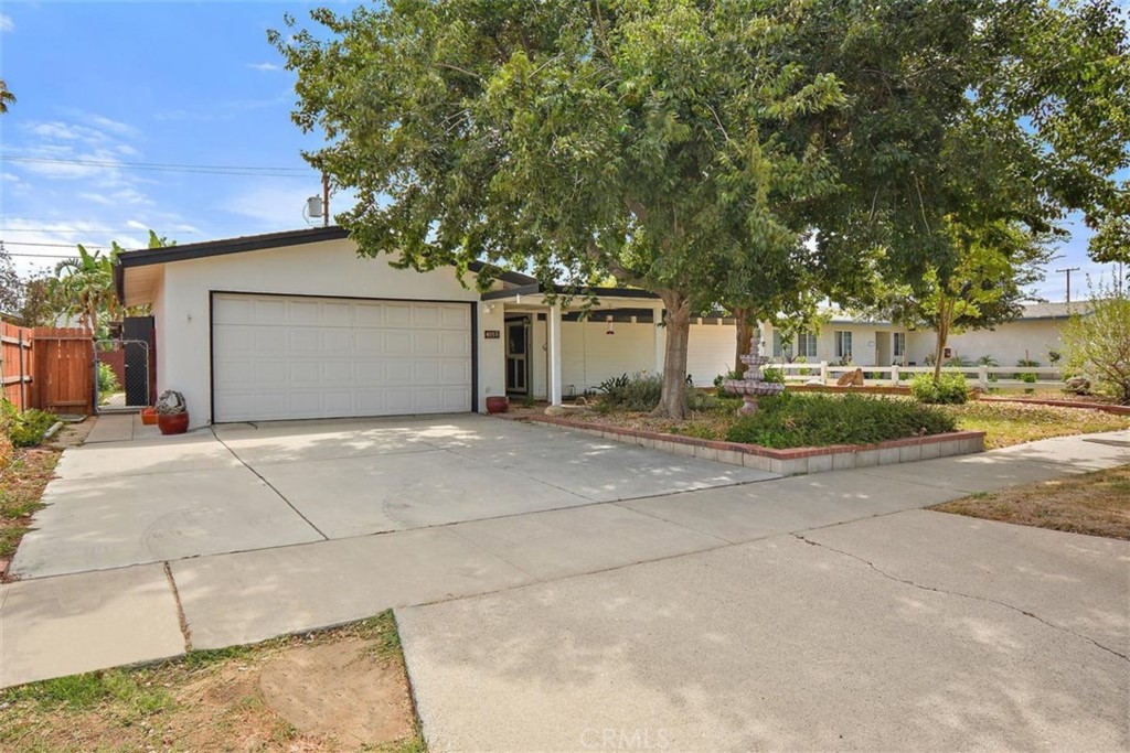 4155 Rucker Lane Riverside, CA 92504 - Photo 1 of 1 a front view of a house with a yard and garage