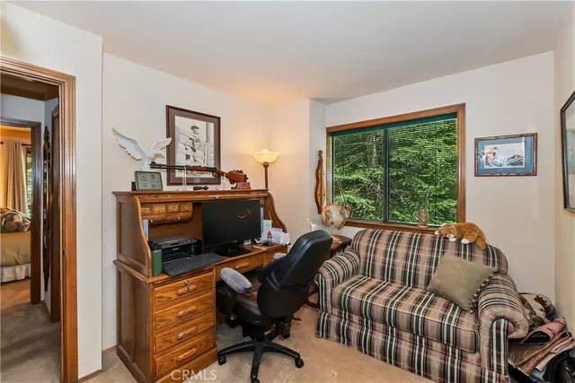 a livingroom with a book shelf