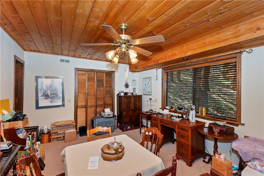 1100 Arbula Drive Crestline, CA 92325 - Photo 30 of 50 a view of a dining room with furniture window and outside view