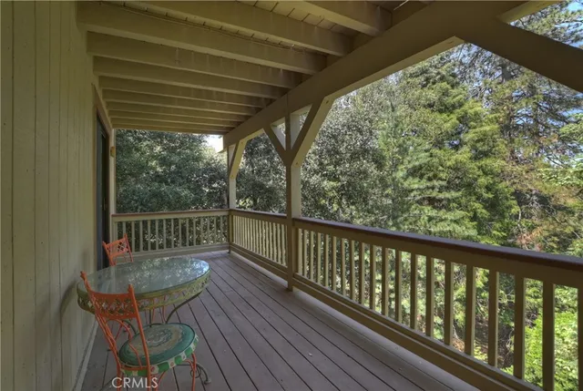 a view of balcony with wooden floor