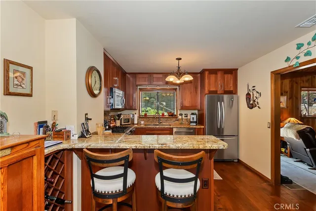 a large kitchen with a table and chairs