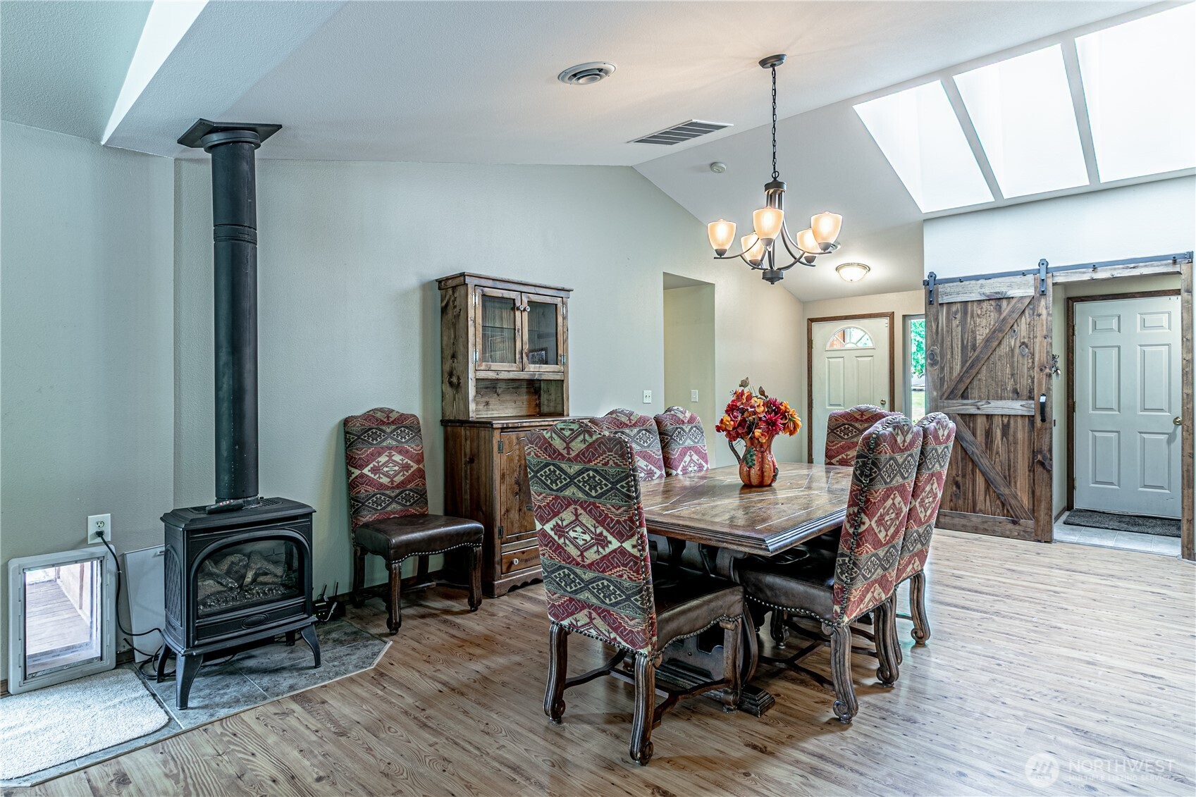 16728 Longmire Road Southeast Yelm, WA 98597 - Photo 23 of 38 a view of a dining room with furniture and wooden floor
