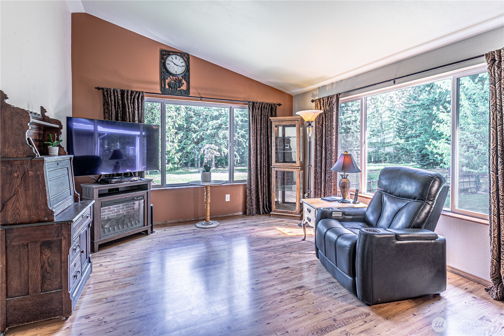 16728 Longmire Road Southeast Yelm, WA 98597 - Photo 24 of 38 a living room with furniture and a large window