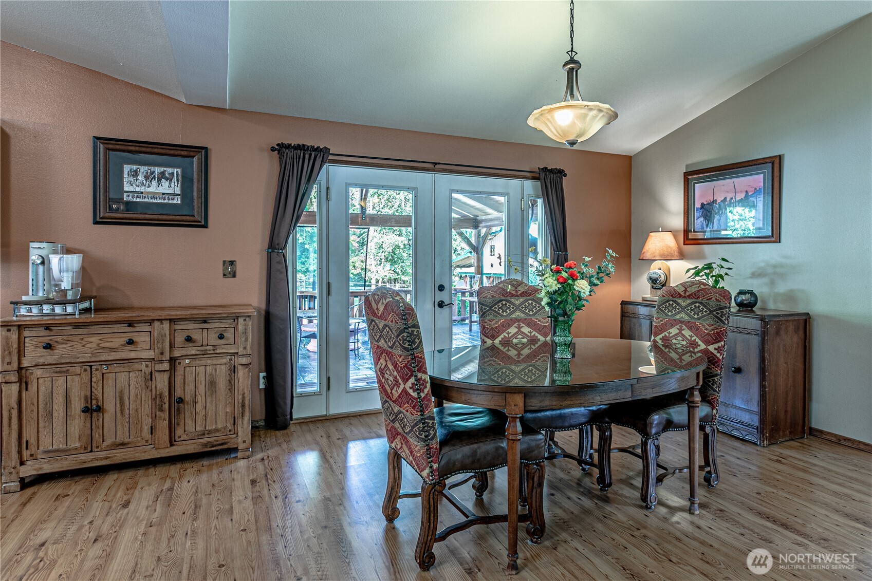 16728 Longmire Road Southeast Yelm, WA 98597 - Photo 25 of 38 a view of a dining room with furniture window and wooden floor