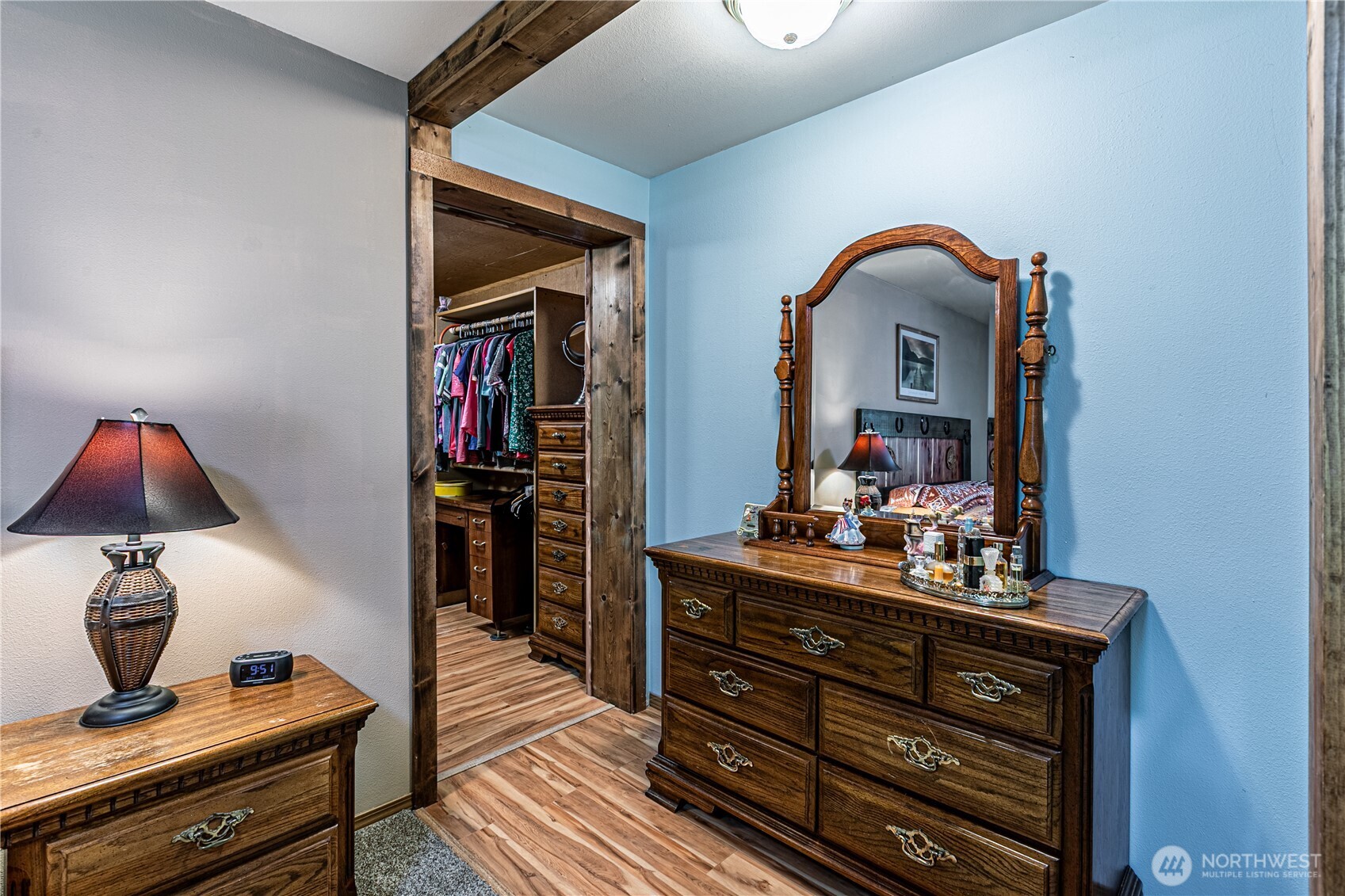 16728 Longmire Road Southeast Yelm, WA 98597 - Photo 28 of 38 a bedroom with a bed and a mirror on the dresser