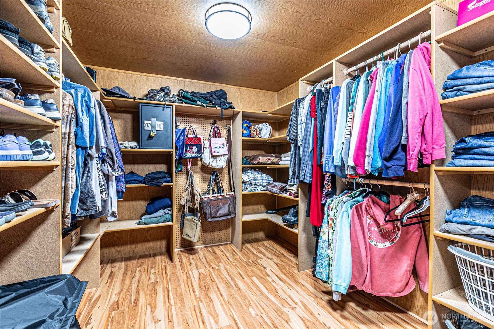 16728 Longmire Road Southeast Yelm, WA 98597 - Photo 29 of 38 a view of walk in closet with clothes and shoes