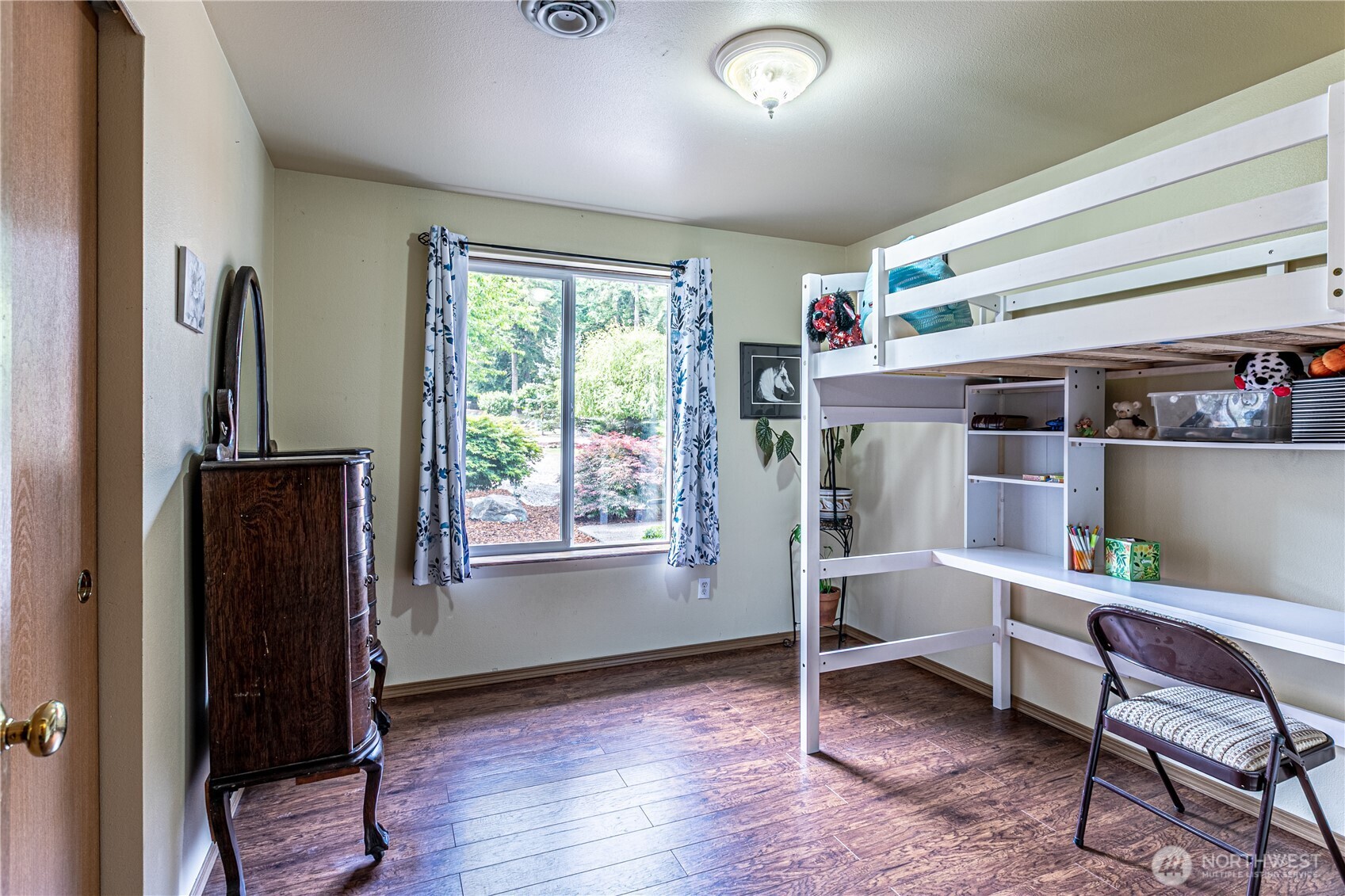 16728 Longmire Road Southeast Yelm, WA 98597 - Photo 31 of 38 a room with furniture and a window