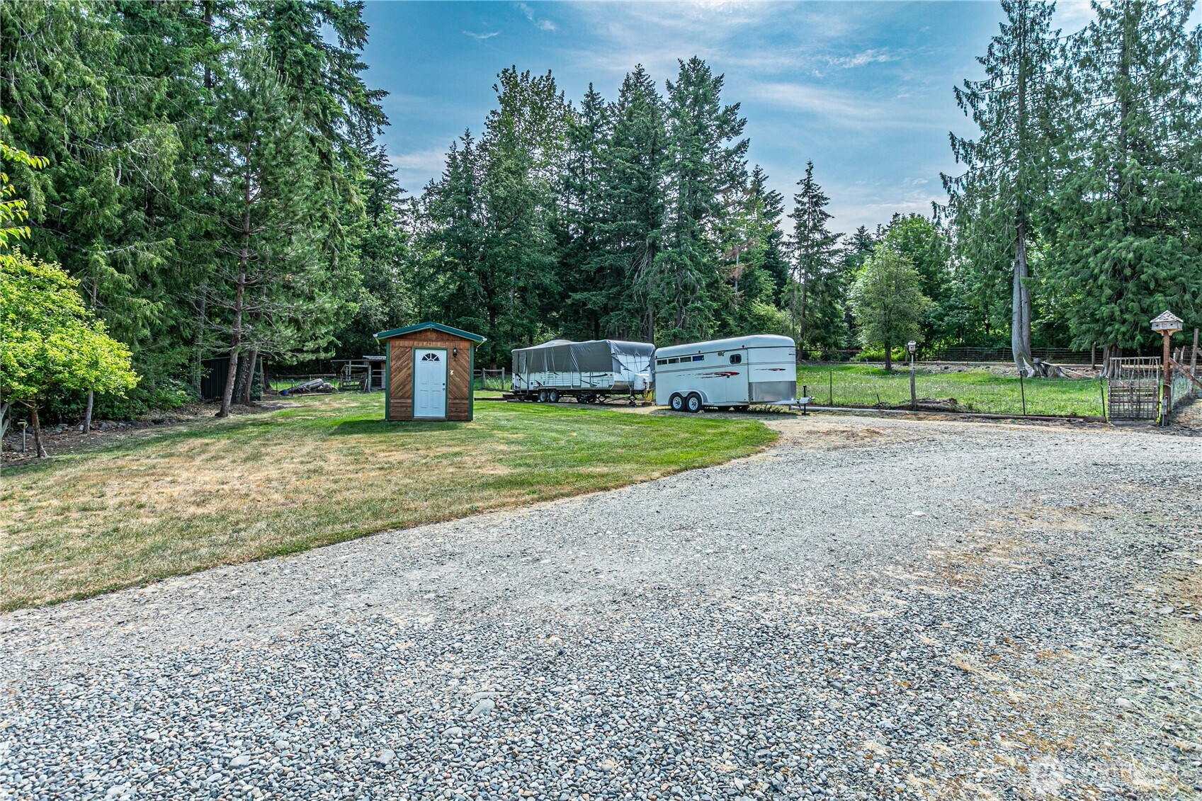16728 Longmire Road Southeast Yelm, WA 98597 - Photo 37 of 38 a view of a yard with wooden fence