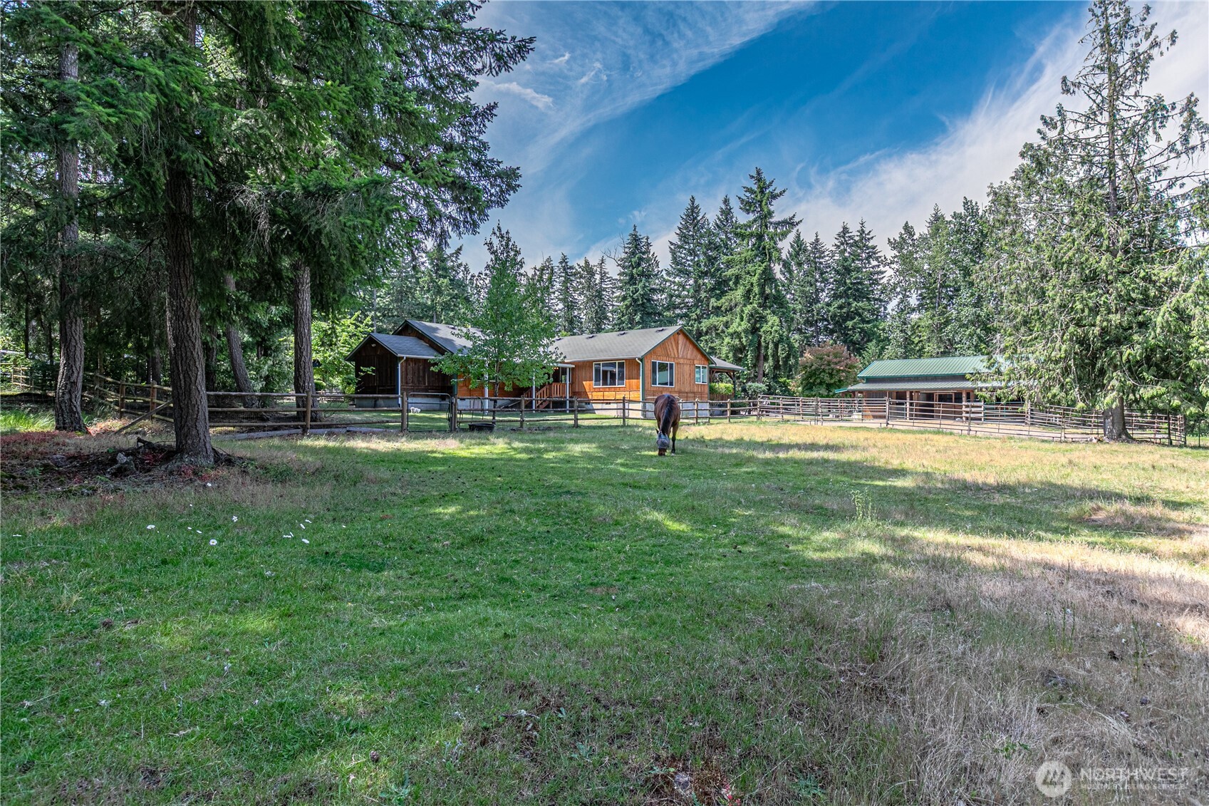 16728 Longmire Road Southeast Yelm, WA 98597 - Photo 38 of 38 a view of a house with a big yard and sitting area
