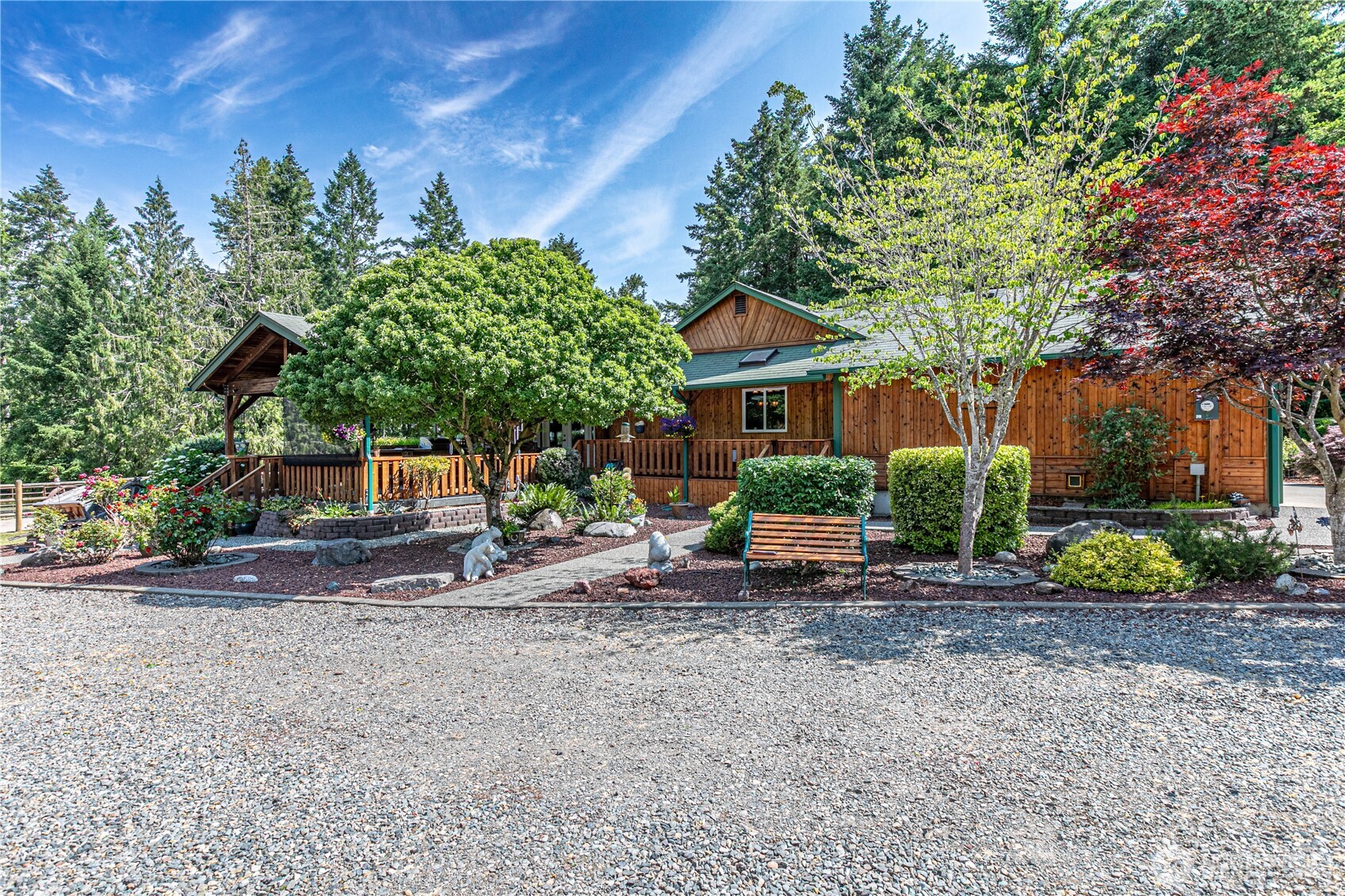 16728 Longmire Road Southeast Yelm, WA 98597 - Photo 5 of 38 a front view of a house with garden