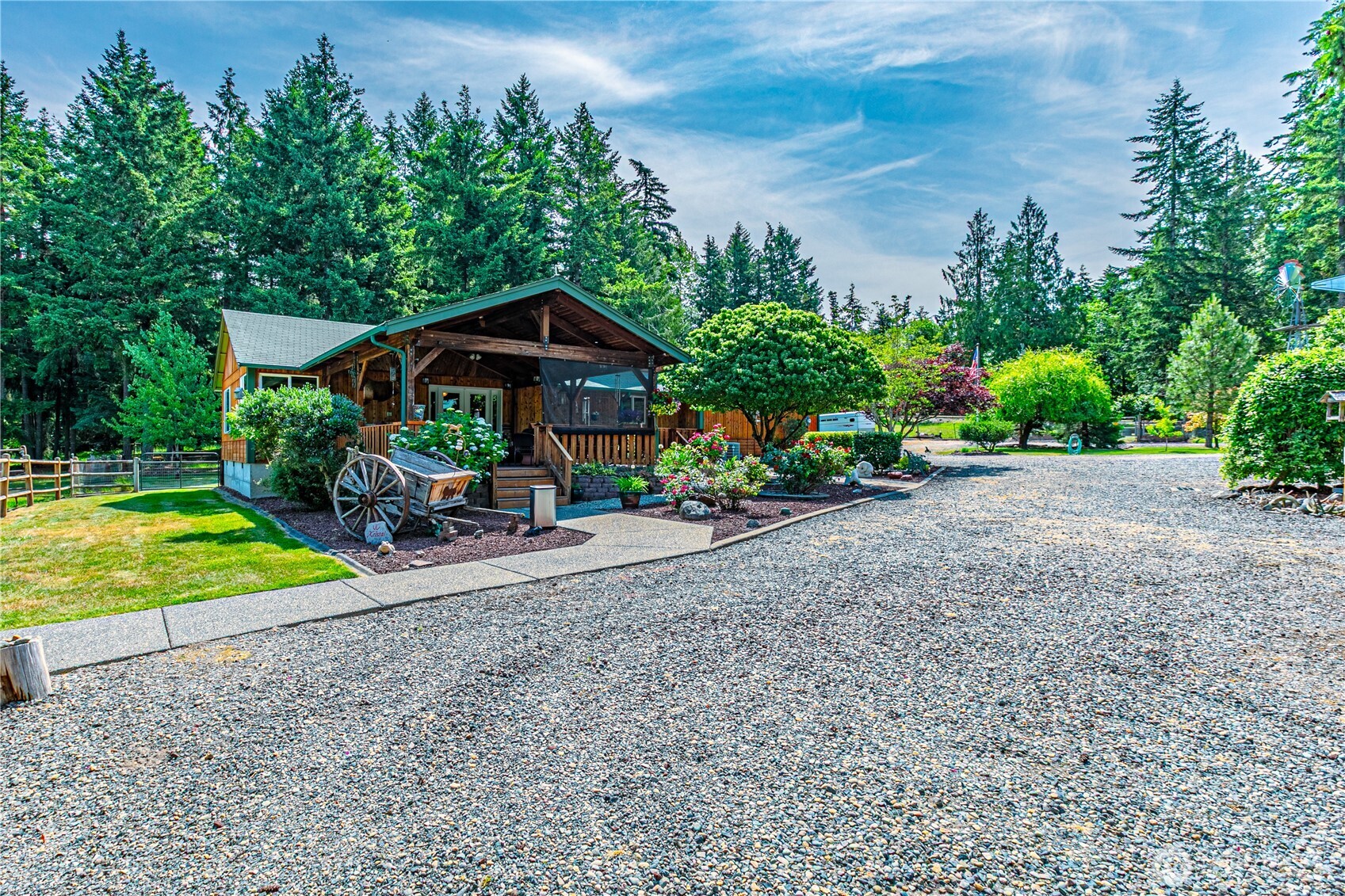 16728 Longmire Road Southeast Yelm, WA 98597 - Photo 6 of 38 a view of a backyard with plants and a garden