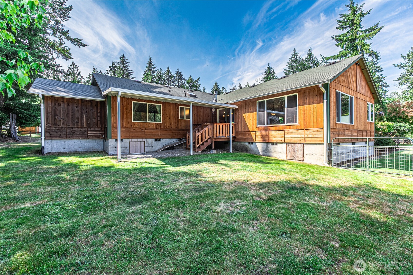 16728 Longmire Road Southeast Yelm, WA 98597 - Photo 7 of 38 front view of a house with a yard