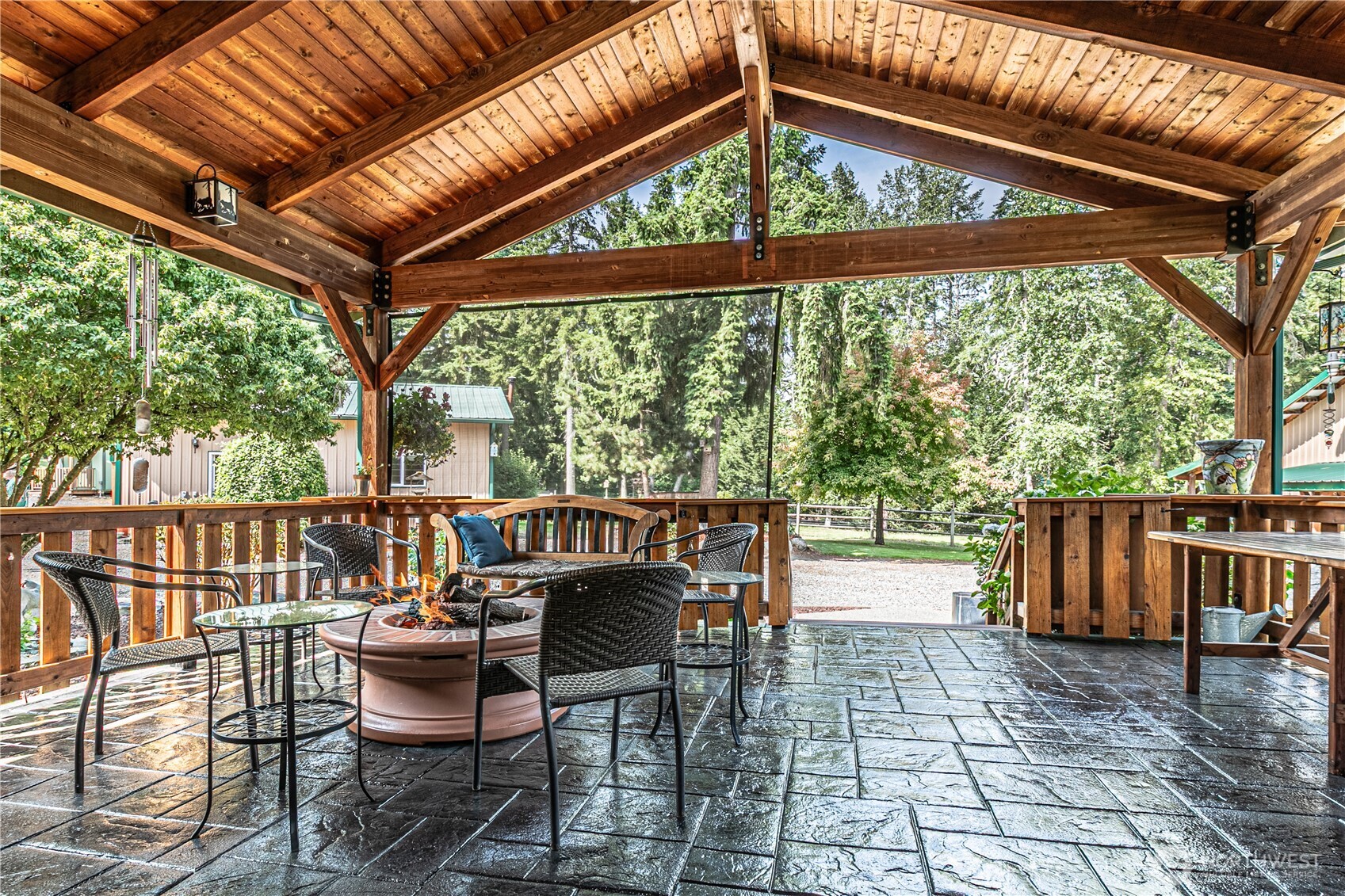 16728 Longmire Road Southeast Yelm, WA 98597 - Photo 8 of 38 a patio with water glass top table and chairs